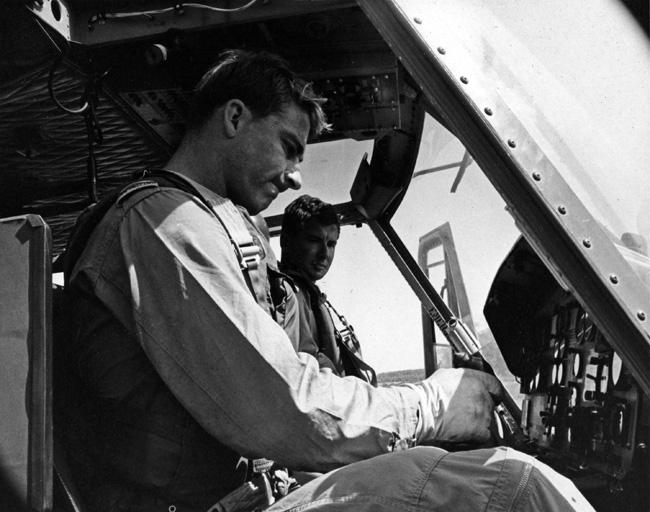 F/O Butler and F/O Creelman carry out final pre-flight checks in the cockpit of a Iroquois helicopter F/O Butler and F/O Creelman carry out final pre-flight checks in the cockpit of a Iroquois helicopter