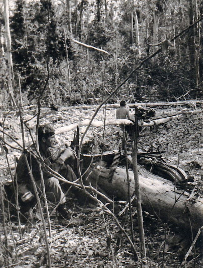 Bruce Isbister takes a drink while on patrol, circa 1968-69