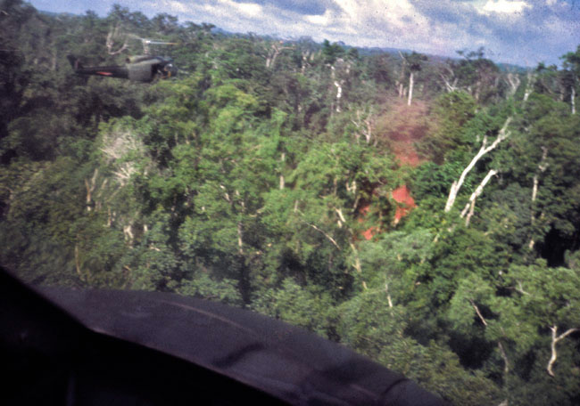 A SAS patrol pops red smoke to guide helicopters to their location