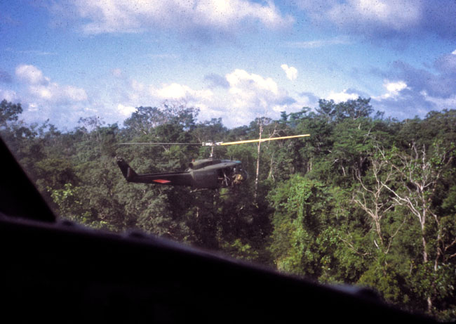 A SAS trooper climbs aboard a helicopter 