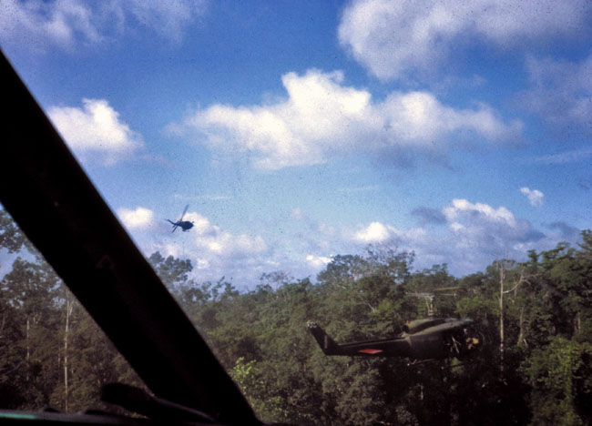 A helicopter gunship pulls away after making a firing pass A helicopter gunship pulls away after making a firing pass
