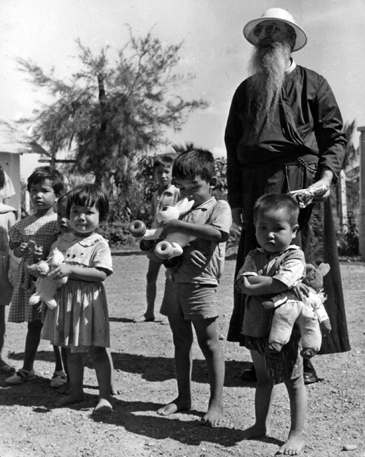 Father Olivier and children at Binh Loi Orphanage