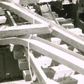 Malcolm Knox Black and white photograph showing the twisted metal of a damaged bridge.