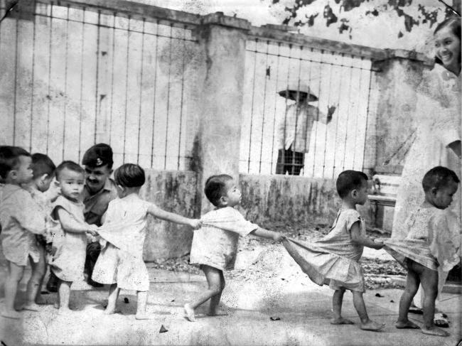 Children line up at a Saigon orphanage, 1968