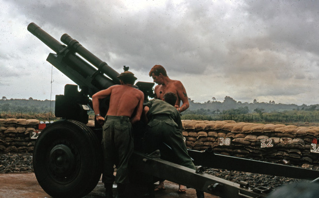 Preparing to fire M101A1 Howitzer, circa 1966-1967 Preparing to fire M101A1 Howitzer, circa 1966-1967
