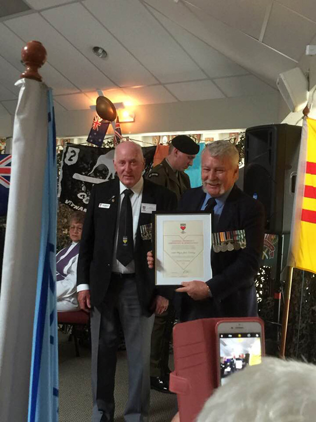 Wayne Lindsay receiving RNZRSA certificate from Robert 'Bukit' Hill