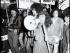 Black and white photograph of Ngā Tamatoa and Polynesian Panthers members marching with signs during an anti-war 'mobilisation' in Auckland, 14 July 1972 