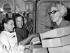 Claire Jacobson hands out lunch to Major P.G. Hotop and his wife