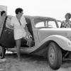 3 smiling women get into a car after a visit to the beach