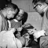 New Zealand Services Medical Team treat a Vietnamese child, Bin Dinh Province, 1970