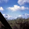 A helicopter gunship pulls away after making a firing pass