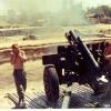 Jim Gilchrist (left) and Selwyn Lilley firing Howitzer in Vietnam, 1969