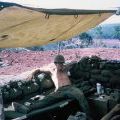 John 'Doc' Mountain relaxing under a canvas awning, 1970