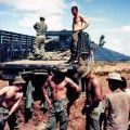 Loading sandbags on truck, circa 1968-1969