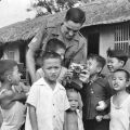 SSgt Graham (Dick) Grigg with Vietnamese orphans