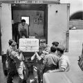 Loading coffins for return to New Zealand