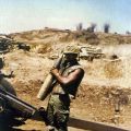 Gunner J.B.T. Kerehona holds the 100,000th New Zealand shell fired in Vietnam